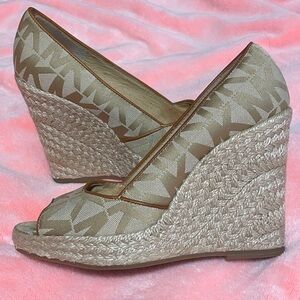 Michael Kors Beige/Brown MK Logo Patterned Wedges
Very comfortable to walk in.